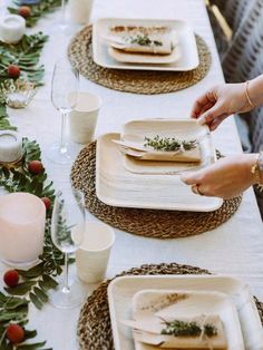 a table set with plates and place settings