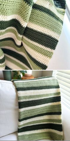 crocheted green and white blanket sitting on top of a couch next to a window