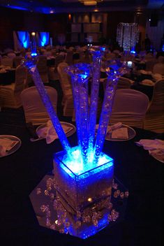 a table with blue lights on it and chairs