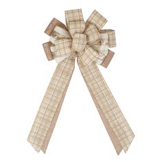 a bow that is on the side of a white wall with brown and tan plaid ribbon