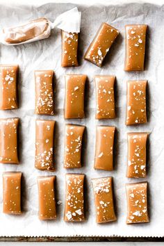 there are many pieces of caramel on the baking sheet