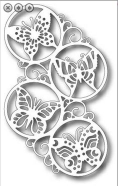 a paper cutout with butterflies and circles in the shape of an ornament