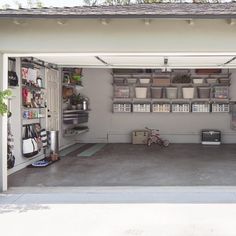 a garage with lots of storage containers on the wall