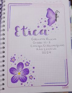 an open notebook with the words etta written in spanish and purple flowers on it