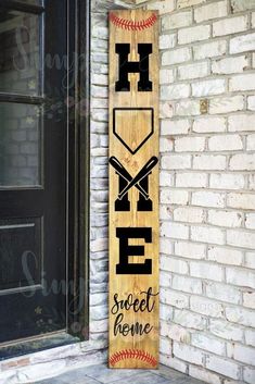 a wooden sign that says home sweet home with baseball bats on it and the word hope written in black