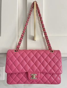 100% AUTHENTIC! CHANEL Caviar Quilted Medium Double Flap This is the most perfect Barbie Pink! Base length: 9.75 in Height: 5.75 in Width: 2.75 in Drop: 9.75 in Drop: 17.25 in This bag is in GOOD condition - no scratches, no corner wear or color transfer. Very minor indentions on the leather (see last 3 pics). This is an authentic CHANEL Caviar Quilted Medium Double Flap in Dark Pink. This shoulder bag is crafted of diamond quilted caviar leather in pink. This bag features a polished light gold chain-link shoulder strap threaded with leather and a frontal flap with a matching gold Chanel CC turn lock. The flap opens to reveal an inner flap and matte pink leather interior with patch pockets. Pink Lifestyle, Gold Chanel, Matte Pink, Luxury Purses, Chanel Caviar, Diamond Quilt, Luxury Brands, Pink Leather, Leather Interior