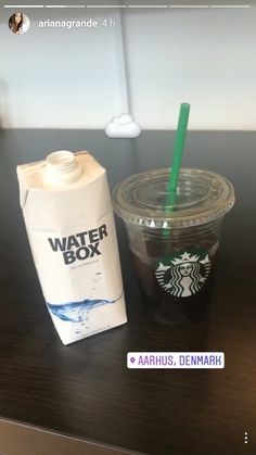 a starbucks drink next to a carton of water