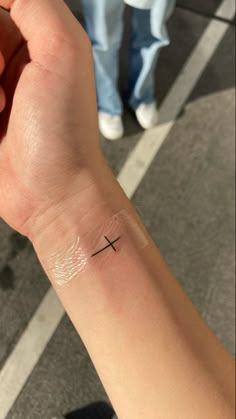 horizontal cross tattoo on right wrist. JESUS LOVES YOU Tattoos Red Ink, Cross Wrist Tattoo, Little Cross Tattoos, Memorial Tattoo Ideas, Tattoo On Wrist, Small Shoulder Tattoos