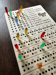 a board game with many different colors and numbers on it, sitting on a table