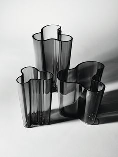 black and white photograph of four vases