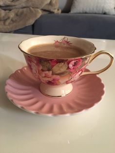 a cup of hot chocolate sits on a saucer