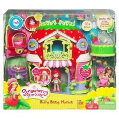 the strawberry shortcake shop playset is in its box and has accessories for it