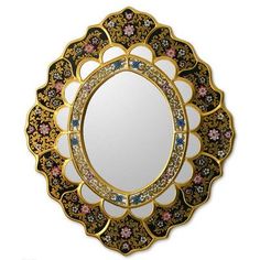 an ornately decorated mirror is shown against a white background