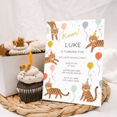 a birthday party with tiger cupcakes and a card for luke is turning five