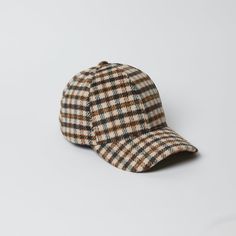 Grab this classic shaped baseball hat in a trendy ivory multi plaid fabric to stay stylish and chic everyday this fall. Shop Black/Grey Material: 100% Polyester Measurements: 13 ¼” x 13”, Brim: 2 ¾”, Head Measurement is 57cm Weight: 3oz Dry Clean Classic Brown Baseball Cap With Curved Visor, Casual Wool Baseball Cap For Winter, Trendy Brown Baseball Cap With Curved Visor, Casual Wool Baseball Cap For Fall, Casual Wool Cap, Winter Curved Brim Baseball Cap, Everyday Fall Baseball Cap With Curved Brim, Classic Fall Baseball Cap, Casual Baseball Cap For Fall