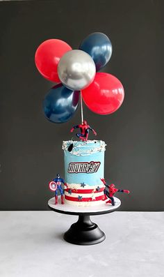 a birthday cake with balloons on top of it