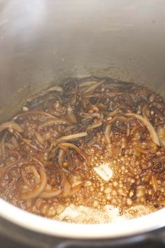 the food is being cooked in the pot on the stove