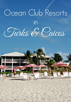 chairs and umbrellas on the beach in front of an ocean club