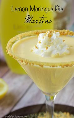 the lemon meringue pie martini is garnished with whipped cream