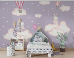 a child's bedroom decorated in pastel colors with balloons and stars on the wall