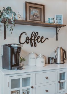 a coffee bar with shelves, cups and mugs on the top shelf next to it