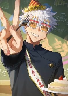 an anime character holding a cake and making the peace sign with his hand while standing in front of a chalkboard