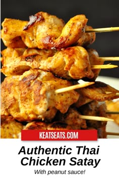 chicken satay is piled on top of each other with the words authentic thai chicken satay