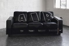 a black couch with white letters on it