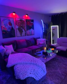 a living room filled with furniture and purple lighting