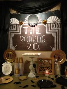 there is a sign that says the roaring 20's on display in front of other decorations