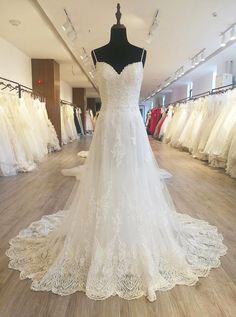 a wedding dress on display in a bridal shop