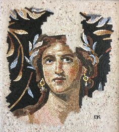 an artistic mosaic with a woman's face and leaves on it