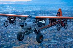 an airplane flying in the air over a city