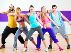 a group of young people dancing together in a dance studio with the words best zumba dvd