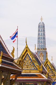 an elaborately decorated building with a flag flying in the background