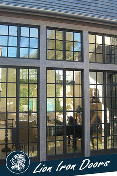 an open patio door with glass panes on the front and side of it, in front of a house