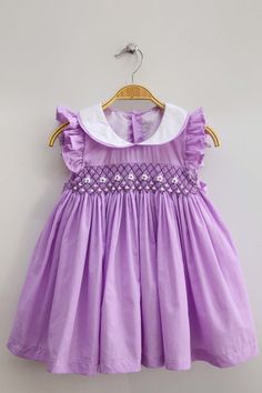 Purple smocked dress white Peter Pan collars – Honey Bee Smocked Boutique Spring Purple Smocked Dress, Purple Smocked Dress For Spring, Lavender Cotton Dress With Ruffles, Purple Smocked Summer Dress With Ruffles, Summer Smocked Dress With Ruffled Collar, Spring Smocked Dress With Ruffled Collar, Fitted Smocked Dress With Ruffled Collar, Spring Smock Dress With Peter Pan Collar, Easter Smocked Dress