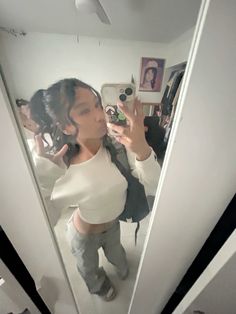 outfit inspo | curly hair | hairstyle inspo | 0.5 | mirror pic | white long sleeve | flared pants | yeezy slides Winter Outfits With Yeezy Slides, Cream Slides Outfit, Onyx Yeezy Slides Outfit Women, Beige Yeezy Slides Outfit, How To Style Yeezy Slides, Yeezy Slide Outfits, Slides Outfit Women, Yeezy Slides Outfit Women, Slide Outfits