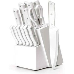 there are many knives in this white holder