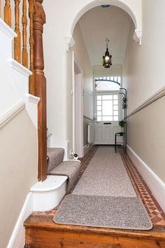 Navigating the selection of hallway runner sizes can be as winding as the corridors they adorn. This article will guide you through the standard dimensions and help you choose the right size runner to complement your hallway's length and width, ensuring both aesthetic appeal and practicality. Large Hallway, Hallway Flooring, Hallway Wall