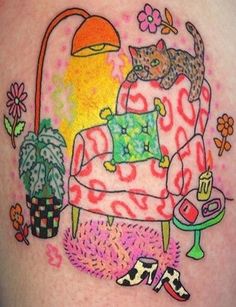 a tattoo with a cat on the arm