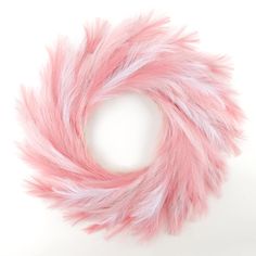 a pink and white fur circle on a white background