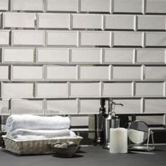 a table topped with lots of different items next to a wall made out of bricks