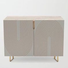 the sideboard is made out of wood and has an abstract design on it's sides