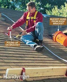 a man working on the roof of a house