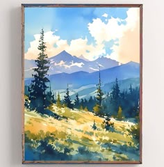 a watercolor painting of mountains and trees on a white wall with a wooden frame