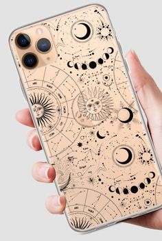 a woman's hand holding an iphone case with the planets and stars on it