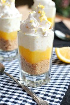 three desserts with lemon and meringue in small glass dishes on a table