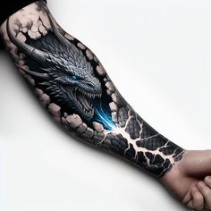 a man's arm with a dragon tattoo on it and an eyeball coming out