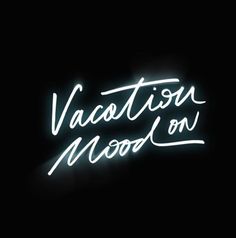 a neon sign that says vacation wood on it